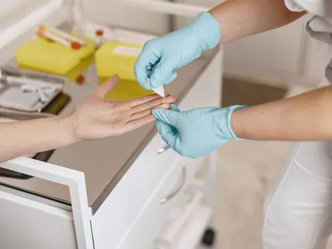 A wound on the hand being dressed