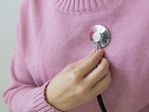 A stethoscope on a woman's chest